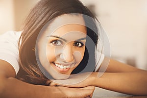 Closeup portrait of cute Indian teenage girl smiling at home