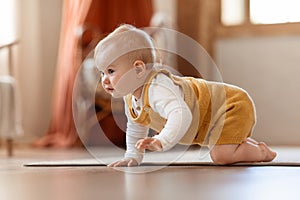 Closeup Portrait Of Cute Little Infant Baby Crawling On Floor