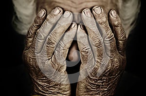 Closeup portrait depressed old woman covering her face with hand