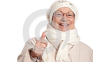 Closeup portrait of elderly woman with thumb up