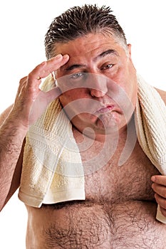 Closeup portrait of an exausted fat man after doing exercises photo