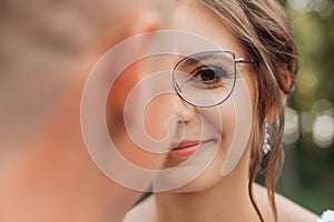 Closeup portrait excited, smiling, saucy curly haired woman in modern eyeglasses with rim looking at camera. Bad vision