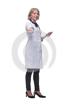 Closeup portrait of female doctor with stethoscope, healthcare professional texting on phone