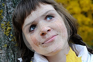 closeup portrait of freckled teenage girl