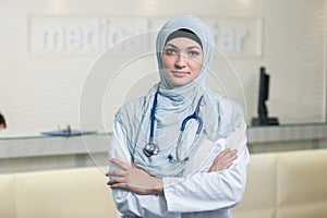 Closeup portrait of friendly, smiling confident muslim female doctor.