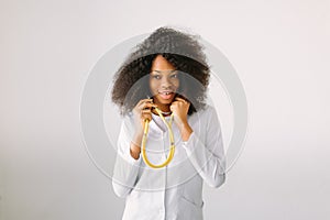 Closeup portrait friendly smiling female doctor, healthcare professional presenting blank copy space isolated white