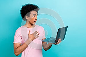 Closeup portrait of funny scared confused handsome guy touch chest bad news forgot save code hold laptop isolated