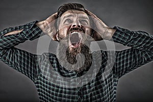 Closeup portrait of a furious young man yelling