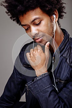 Closeup portrait of handsome African American man listening to music