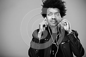 Closeup portrait of handsome African American man listening to music