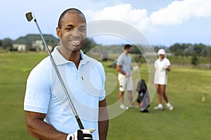 Closeup portrait of handsome black golfer photo