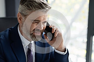 Closeup Portrait Of Handsome Middle Aged Businessman Making Phone Call In Office