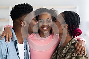 Closeup portrait of happy black family greeting mother soldier