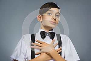 Closeup Portrait of happy boy going surprise isolated on gray background