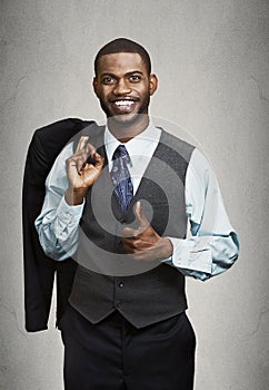 Closeup portrait happy businessman giving thumbs up