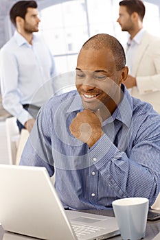 Closeup portrait of happy businessman working