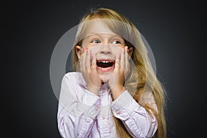 Closeup Portrait happy girl going surprise on gray background