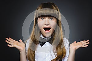 Closeup Portrait happy girl going surprise isolated on gray background