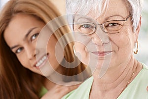 Closeup portrait of happy mother and daughter