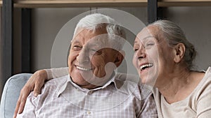 Closeup portrait happy older spouses smile look into distance