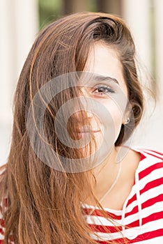 Closeup portrait of happy woman covers her face with hair, hairs