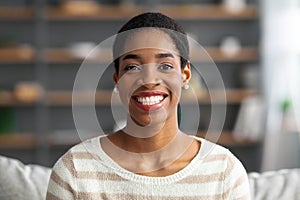 Closeup Portrait Of Happy Young Black Woman Posing In Home Interior