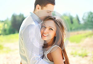 Closeup portrait of happy young couple in love, sunny summer