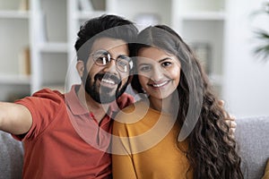 Closeup Portrait Of Happy Young Indian Couple Taking Selfie Together At Home