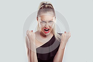 Closeup portrait head shot angry young woman having nervous breakdown screaming isolated white wall background. Negative human