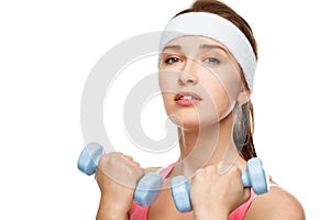 Closeup portrait healthy athletic woman lifting weights