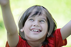 Closeup portrait of a little boy outside