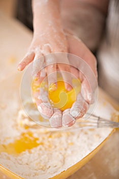 Closeup portrait of little child cooking egg