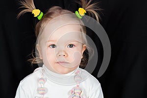 Closeup portrait of little girl with funny scrunchy