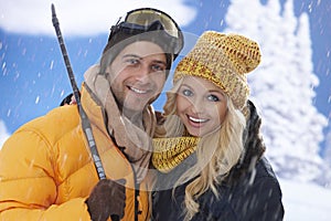 Closeup portrait of loving couple in snowfall