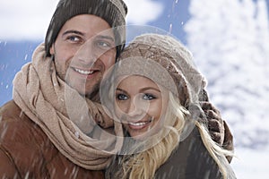 Closeup portrait of loving couple at wintertime