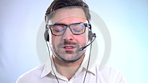 Closeup portrait of male customer service representative or call centre worker or operator or support staff speaking