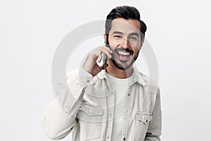 Closeup portrait man talking on the phone smile with teeth happiness and laughter on white  background, fashion