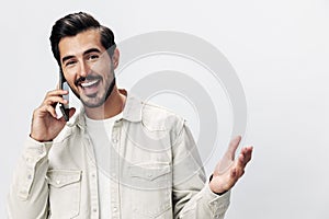 Closeup portrait man talking on the phone smile with teeth happiness and laughter on white  background, fashion