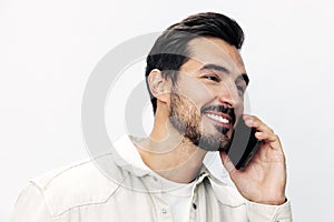 Closeup portrait man talking on the phone smile with teeth happiness and laughter on white  background, fashion