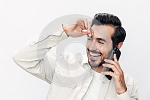 Closeup portrait man talking on the phone smile with teeth happiness and laughter on white  background, fashion