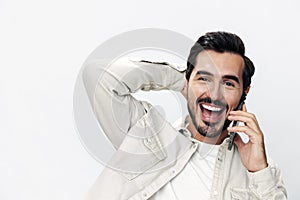 Closeup portrait man talking on the phone smile with teeth happiness and laughter on white isolated background, fashion