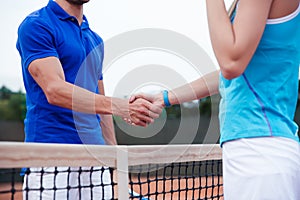 Closeup portrait of a man and woman handshaking