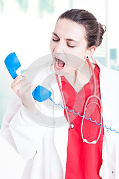 Closeup portrait of medic yelling on receiver