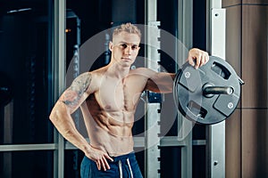 Closeup portrait of a muscular man workout with