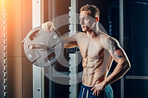 Closeup portrait of a muscular man workout with