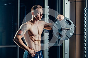 Closeup portrait of a muscular man workout with