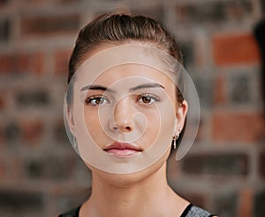 Closeup portrait of one serious woman alone in gym. Headshot of beautiful focused caucasian trainer standing after