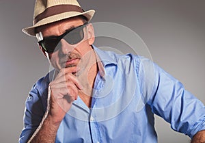 Closeup portrait of pensive mature man with open shirt