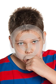 Closeup portrait of a pensive young boy