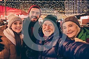 Closeup portrait photo of full family four relatives people x-mas meeting take selfie show v-sign hug outerwear hat